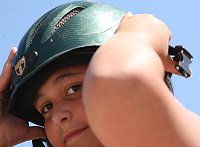 Bree adjusts her helmet. 