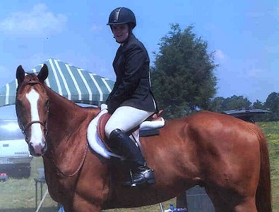 Our Boy Darcy and Jessica at a horse show.