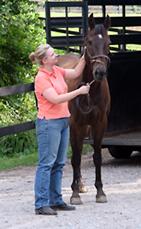 Mamie Kerr welcomes Queen's Rowdy Lad home to Bit & Byes Farm.. July 12, 2007