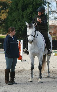 Vera Vogt demonstrates to Amy dressage concepts to apply.