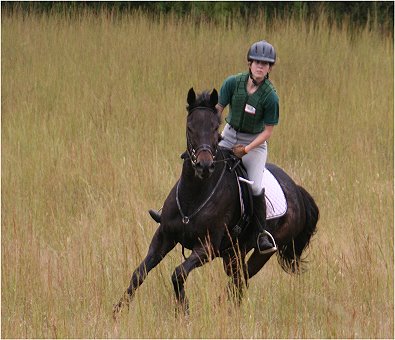 Marie van Roekel and Two Thumbs up enjoy a gallop at the poker ride. October 8, 2005