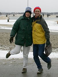 Heather and Barry warming their feet at the track.
