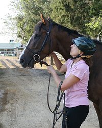 Nancy saddles Dream Pusher for their first ever hunter pace.
