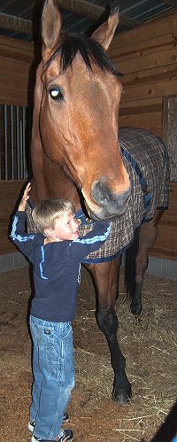 Jake hugs OTTB Phil's Courage.