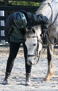 Elizabeth gives Sing D Song a hug after their first ride together. March 18, 2007
