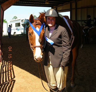 Our Boy Darcy wins an equitation medal for his mom.