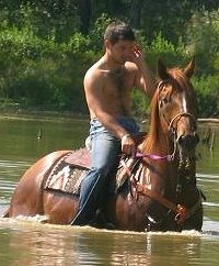 OTTB swims in lake with Amanda's friend Cody.