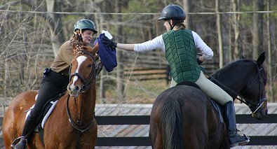 Elizabeth hands off to Marie in the Pony Express game.