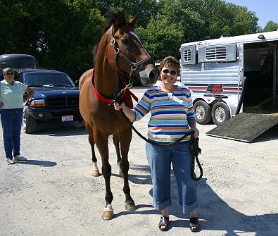 Daring Deeds and his new mom Carol and future trainer Cheri in the background.