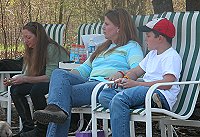 Lise, Dana and Jordon watch the jumping competition.