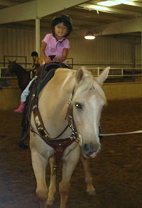 Paula's daughter Elizabeth enjoys riding too!